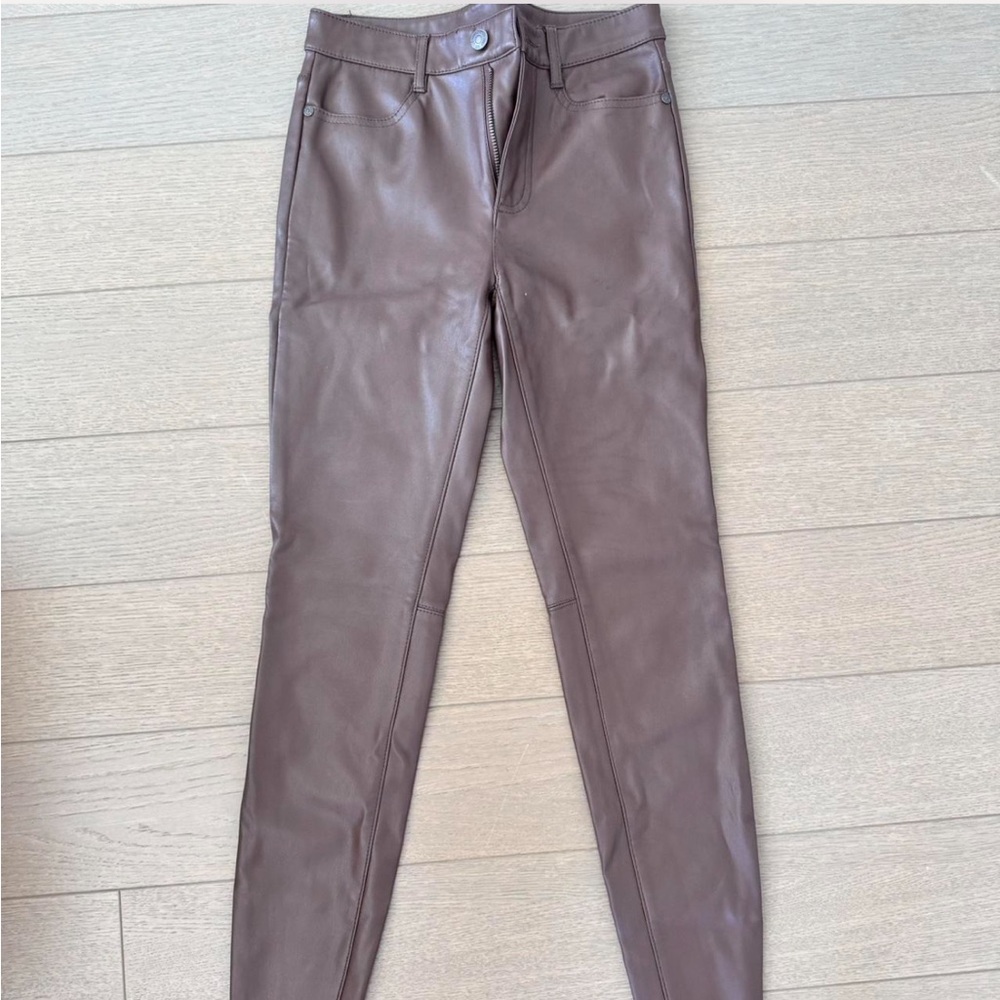Free People faux leather pants in chocolate brown. Size 25 but fits like a 24.